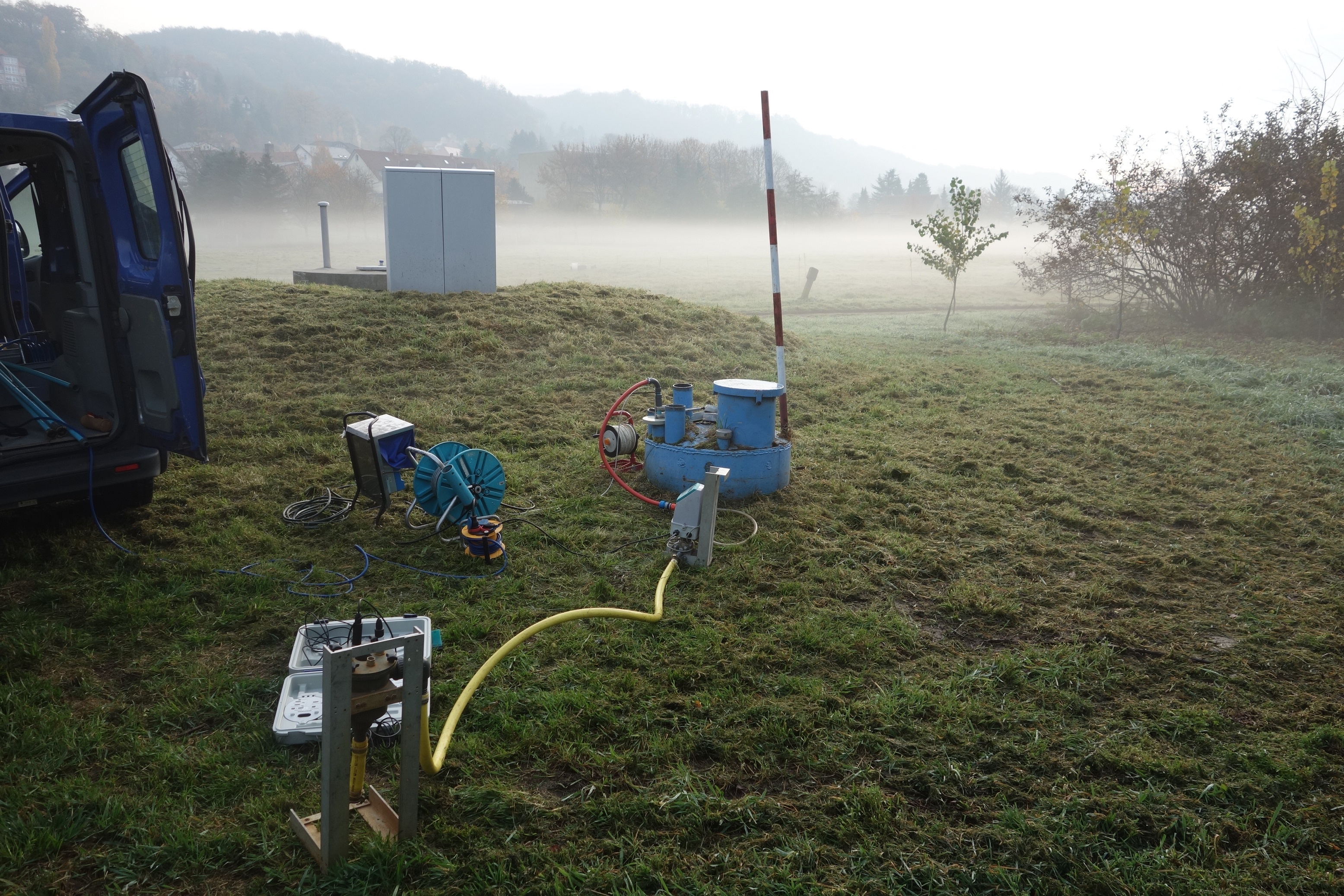 Groundwater monitoring well in the morning dew