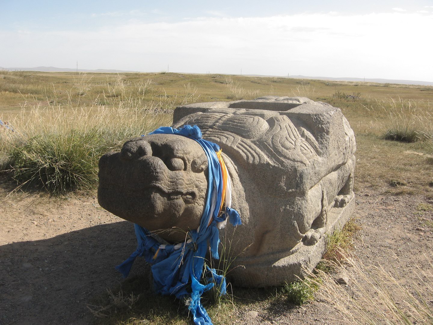 Image, showing a large, granite tortoise sculpture.