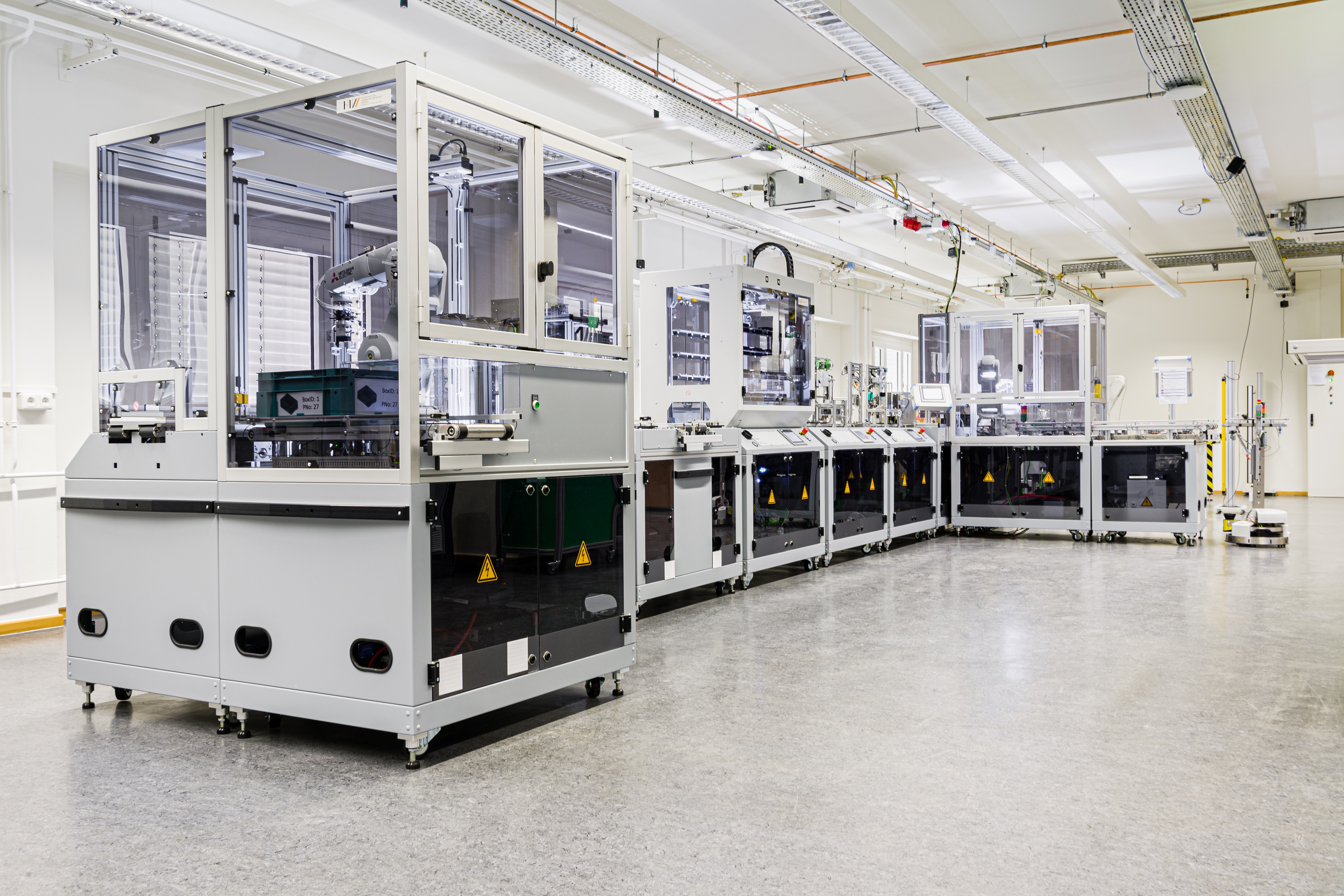 View in the Industrial Internet of Things Test Bed. You see a production line with different stations.