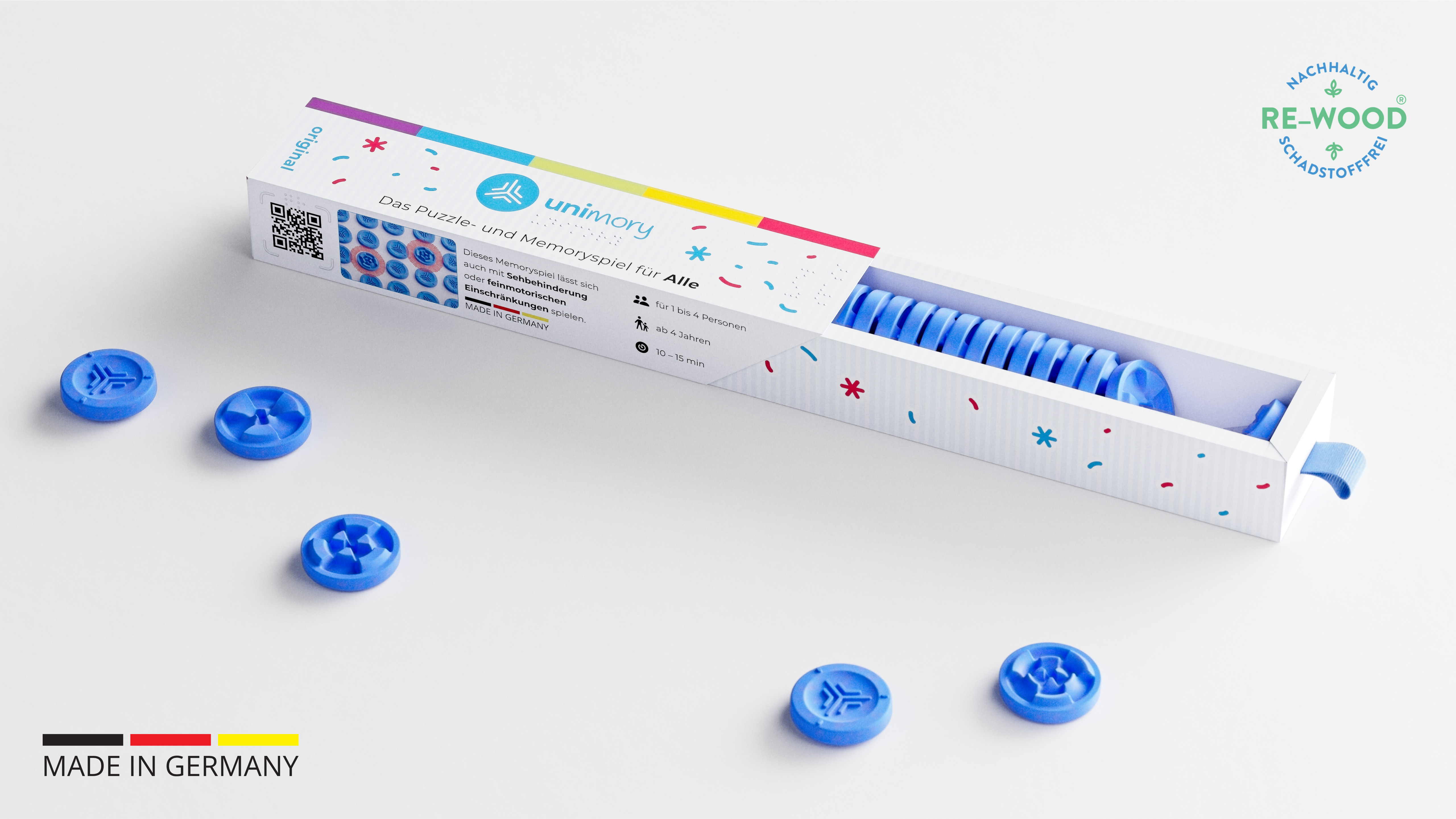 ein geöffnetes unimory Spiel vor dem einige Spielsteine liegen ist zu sehen