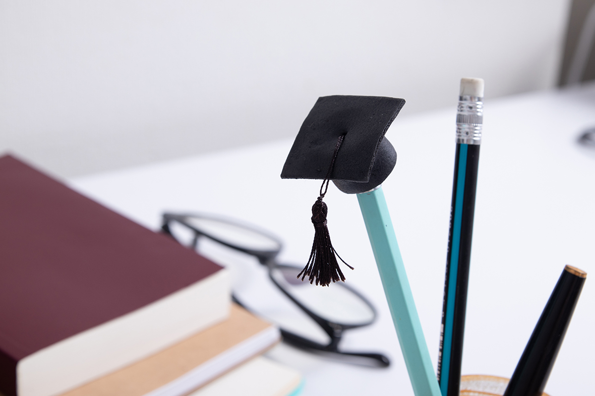 pencils and academic hat