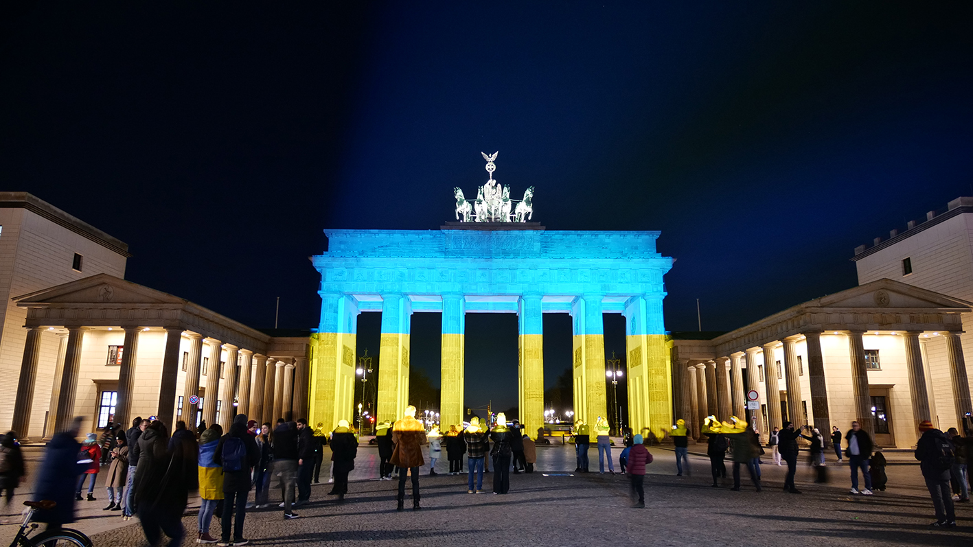 The Brandenburg Gate in Berlin lit up in the Ukrainian national colours
