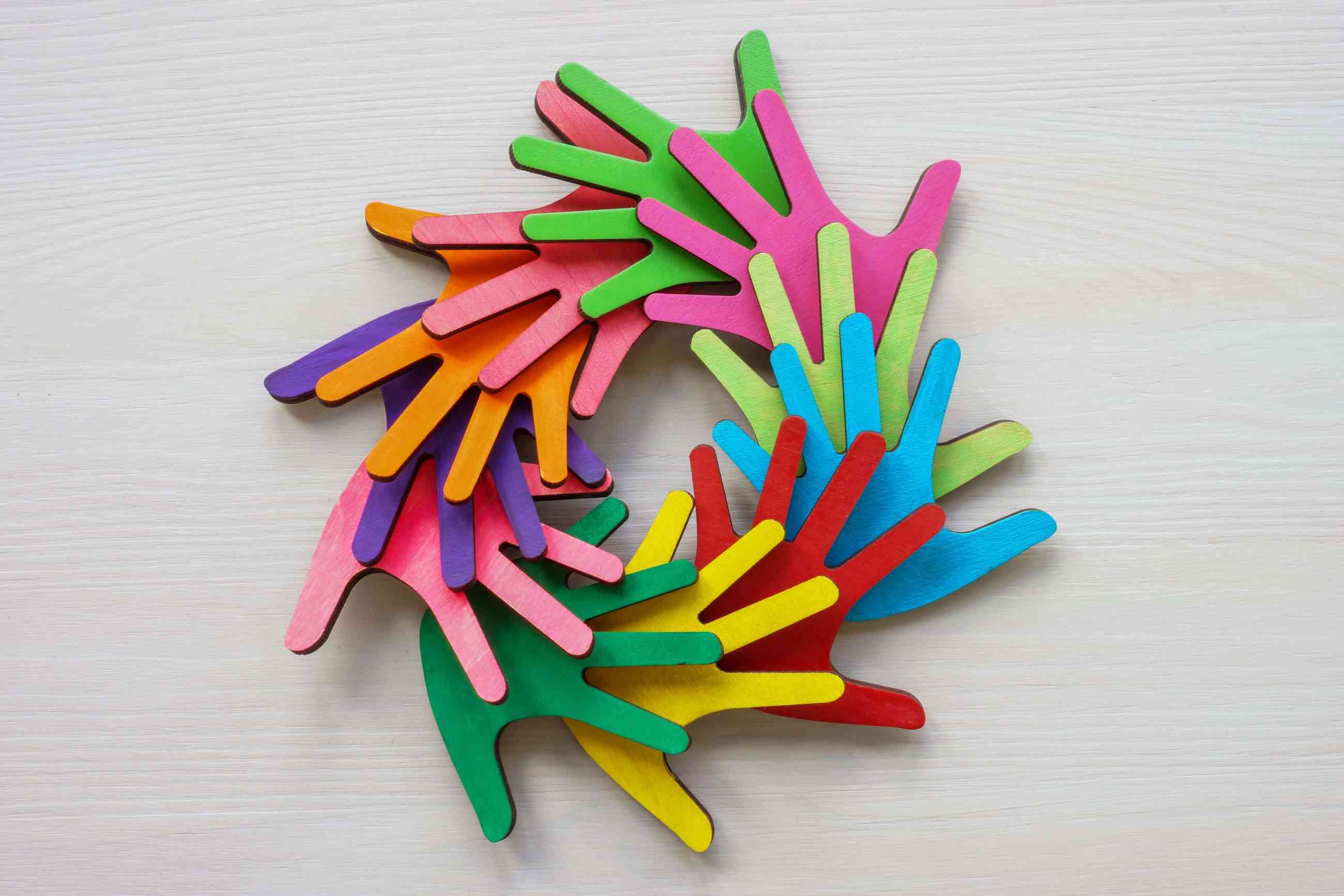 colourful paper hands forming a circle