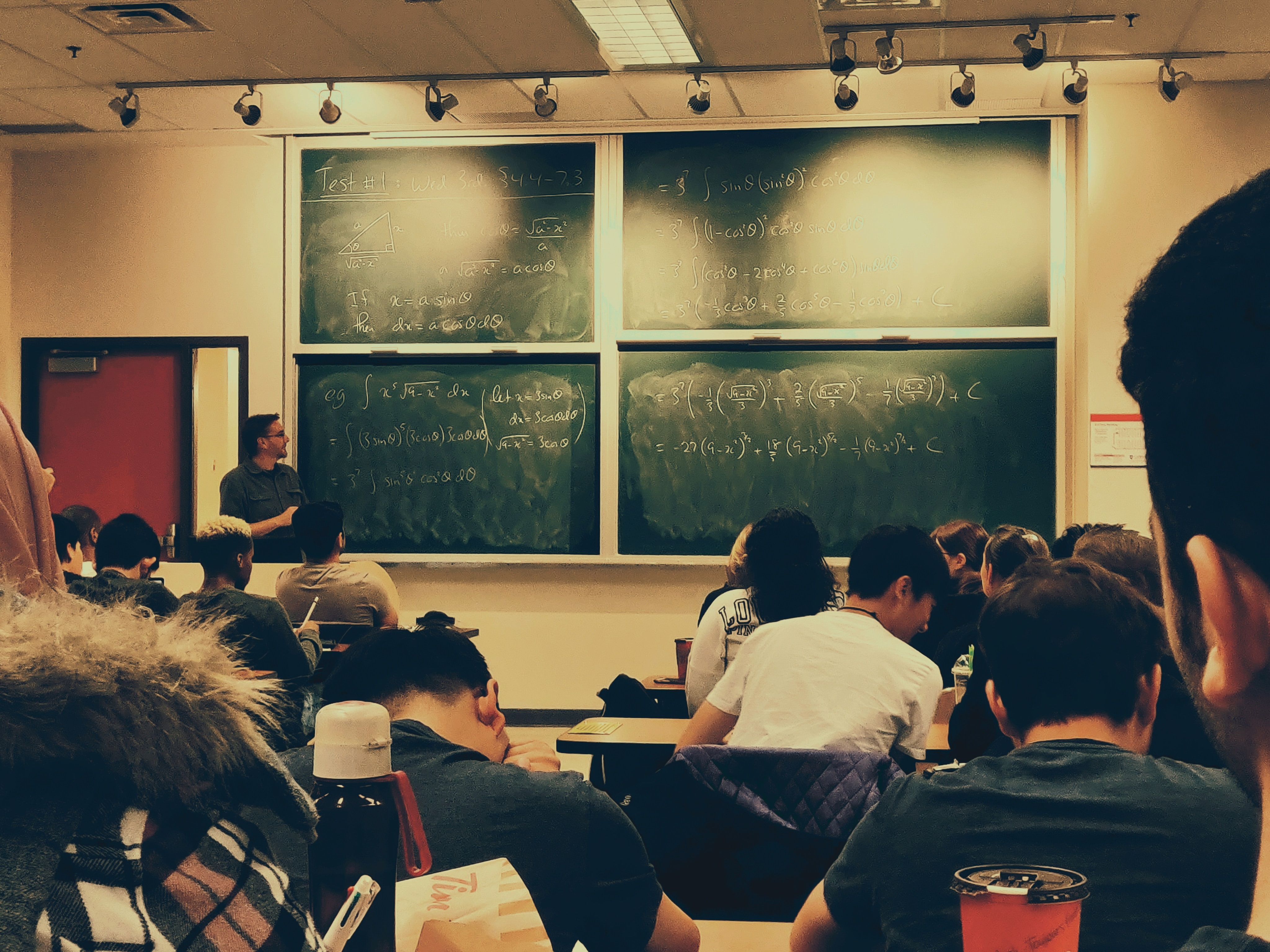 Teacher in front of blackboard