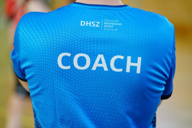 Rücken mit der Aufschrift Coach