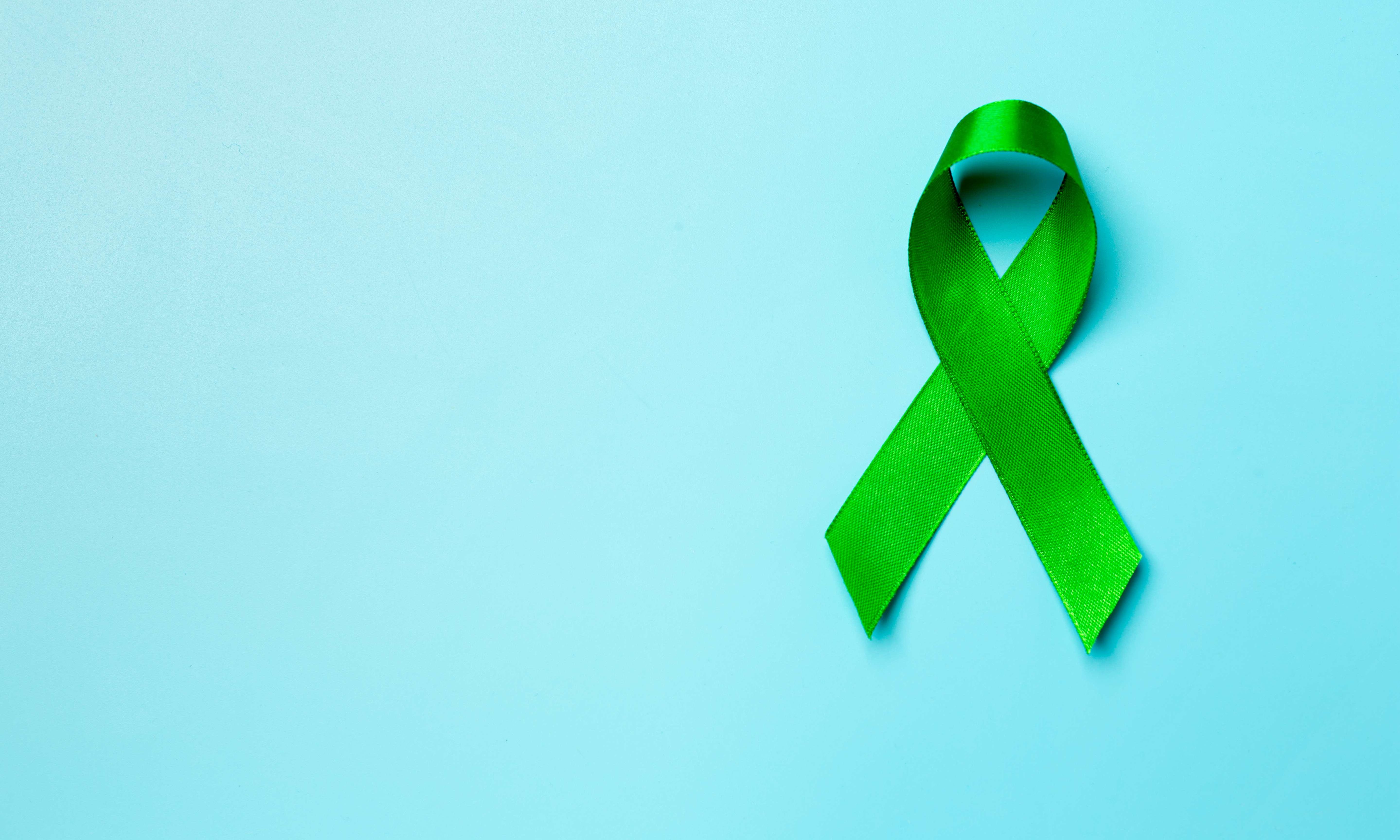 grüne Schleife als Symbol für Antistigmatisierung von psychischen Erkrankungen