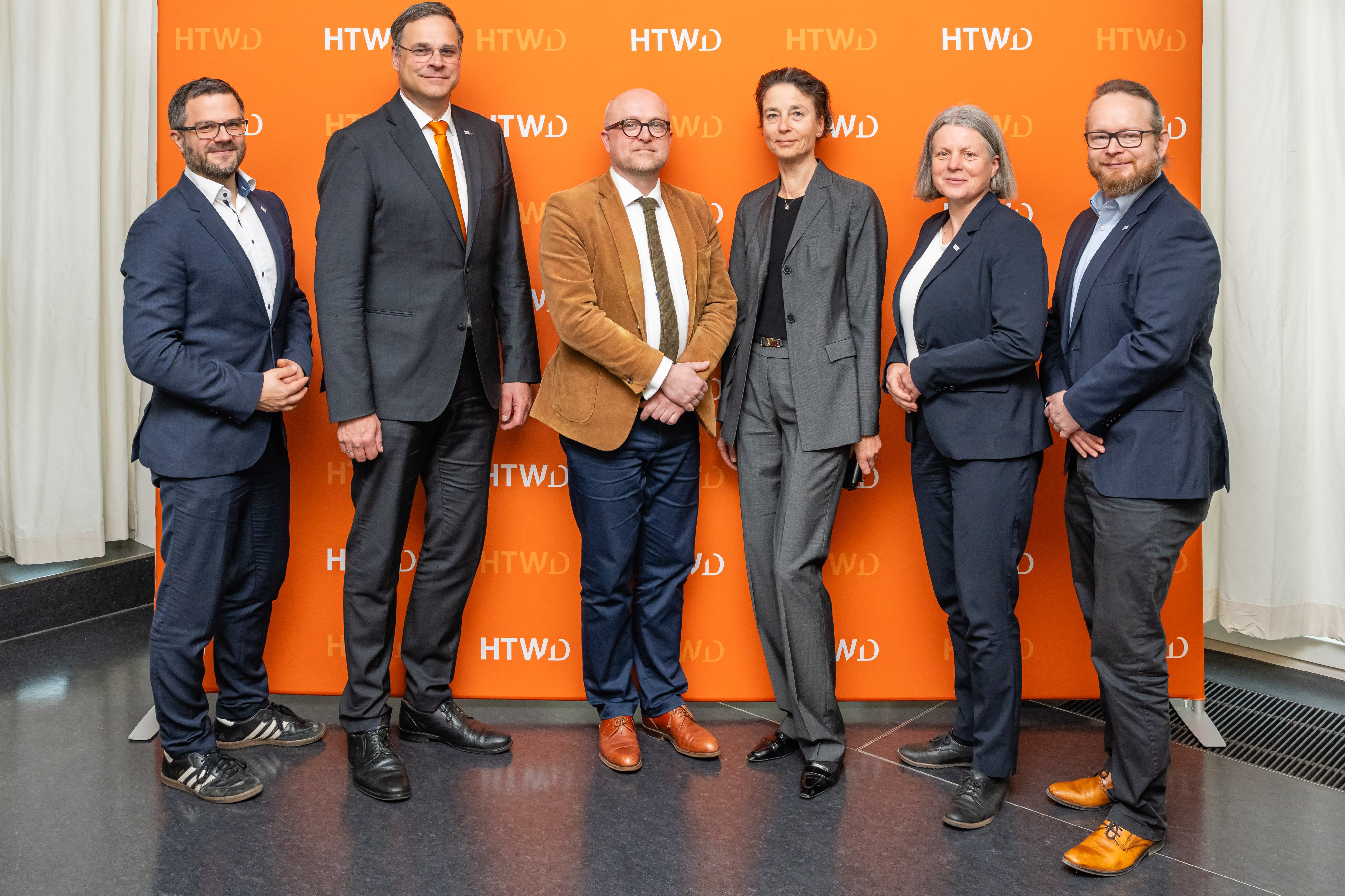 Die Hochschulleitung der HTWD begüßt Robert Denk und Simona Block aus dem SMWK