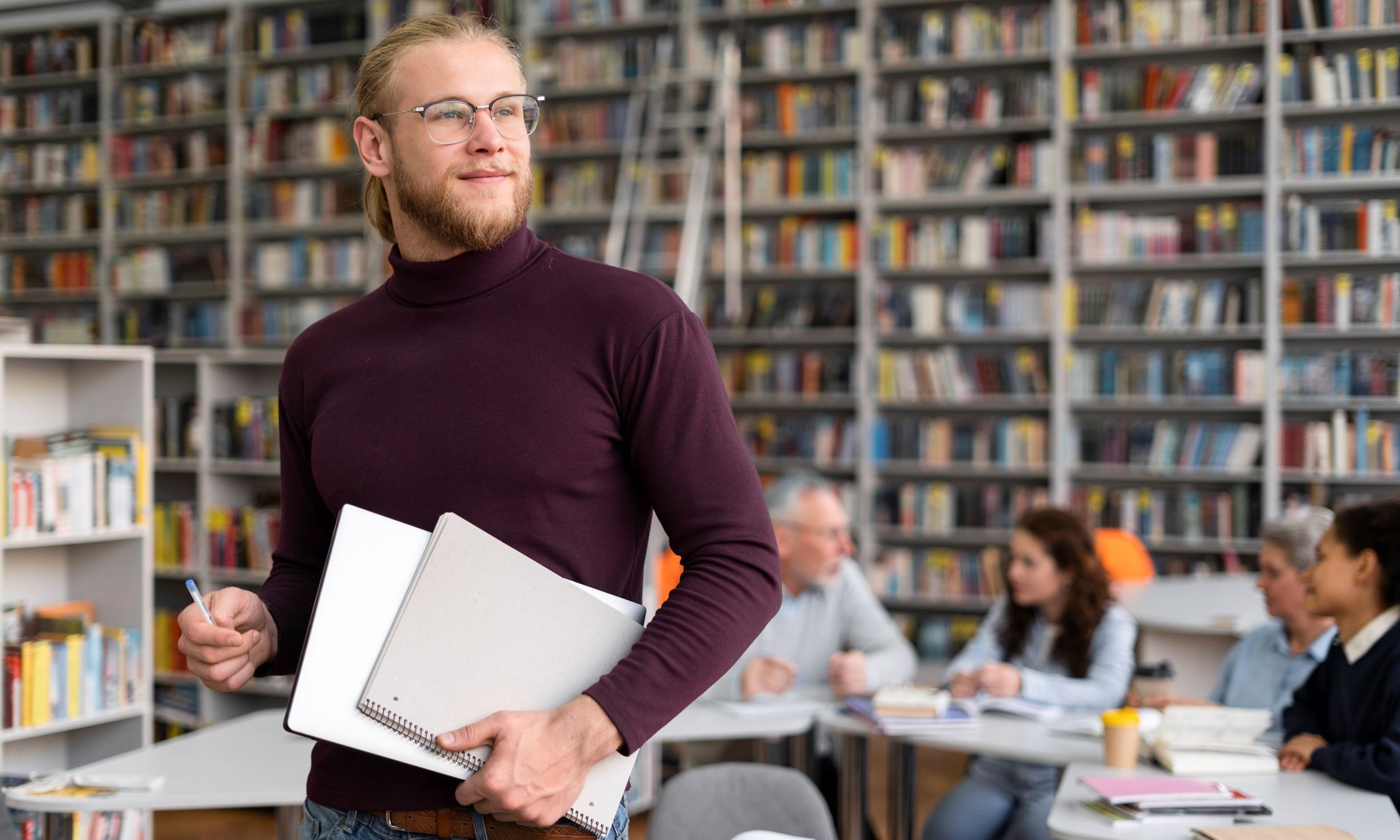 man holding notebook